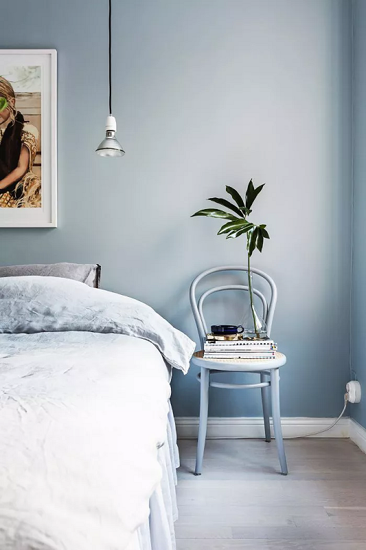a-Nordic-apartment-bedroom-with-icy-blue-wall-color-to-make-it-look-bigger.
