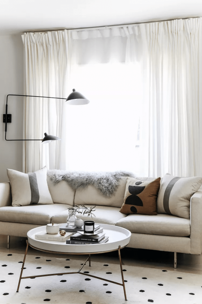 tips to style a sofa for small spaces with throw pillows and sheepskins throws