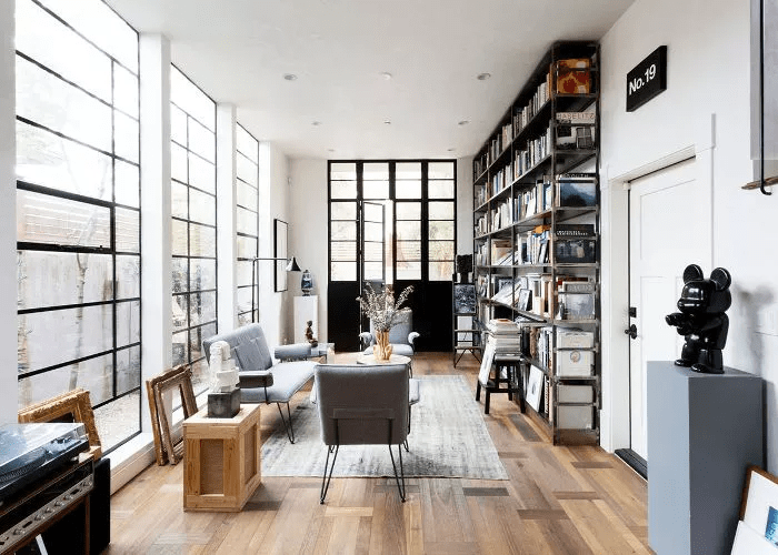 Modern living room with open floor plan and with industrial windows