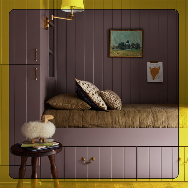 cozy reading nook painted in yellow mustard and plum wall colors.