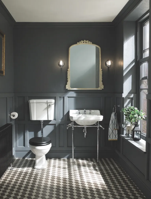 modern all black small powder room with wall sconce and ceiling light fixture and natural light