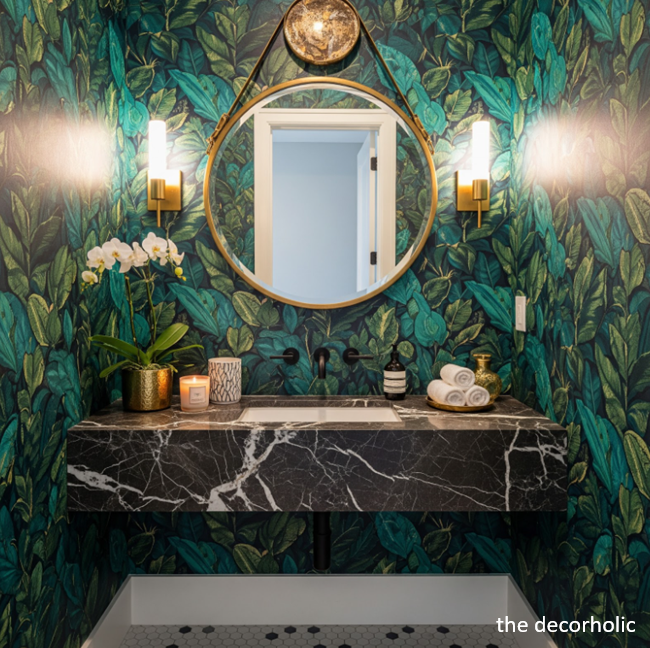 modern small powder room with green floral wallpaper and black marble vanity